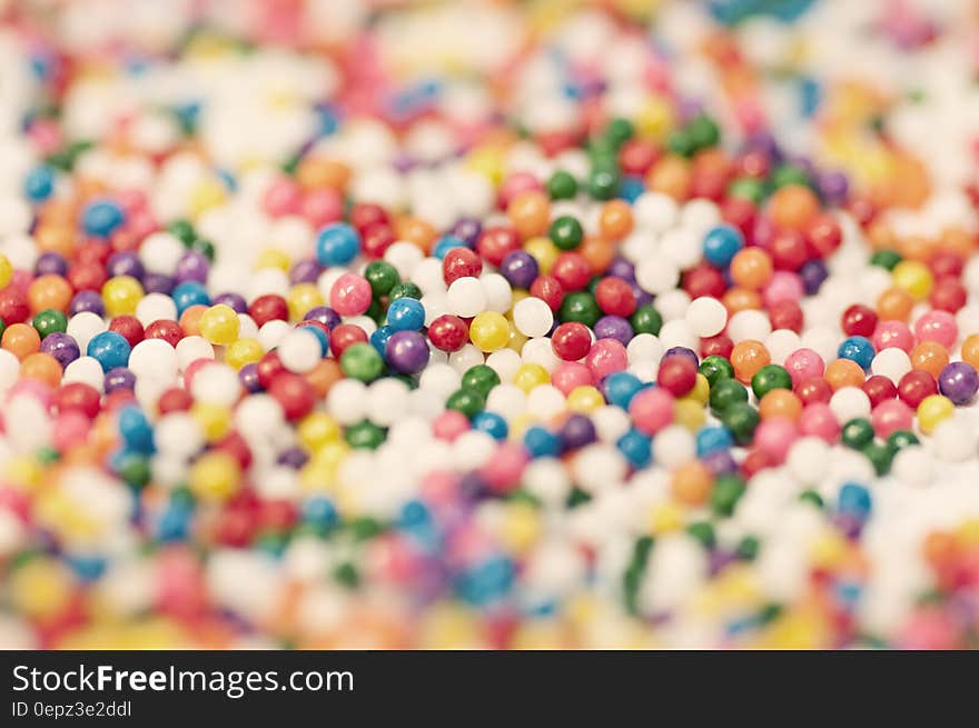 A bunch of tiny beads of different color. A bunch of tiny beads of different color.