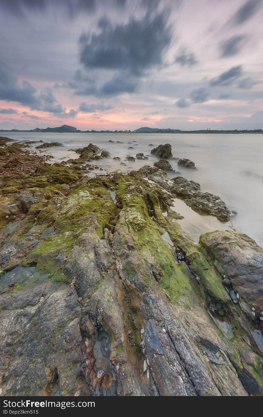 A view over a rocky coast at dusk.