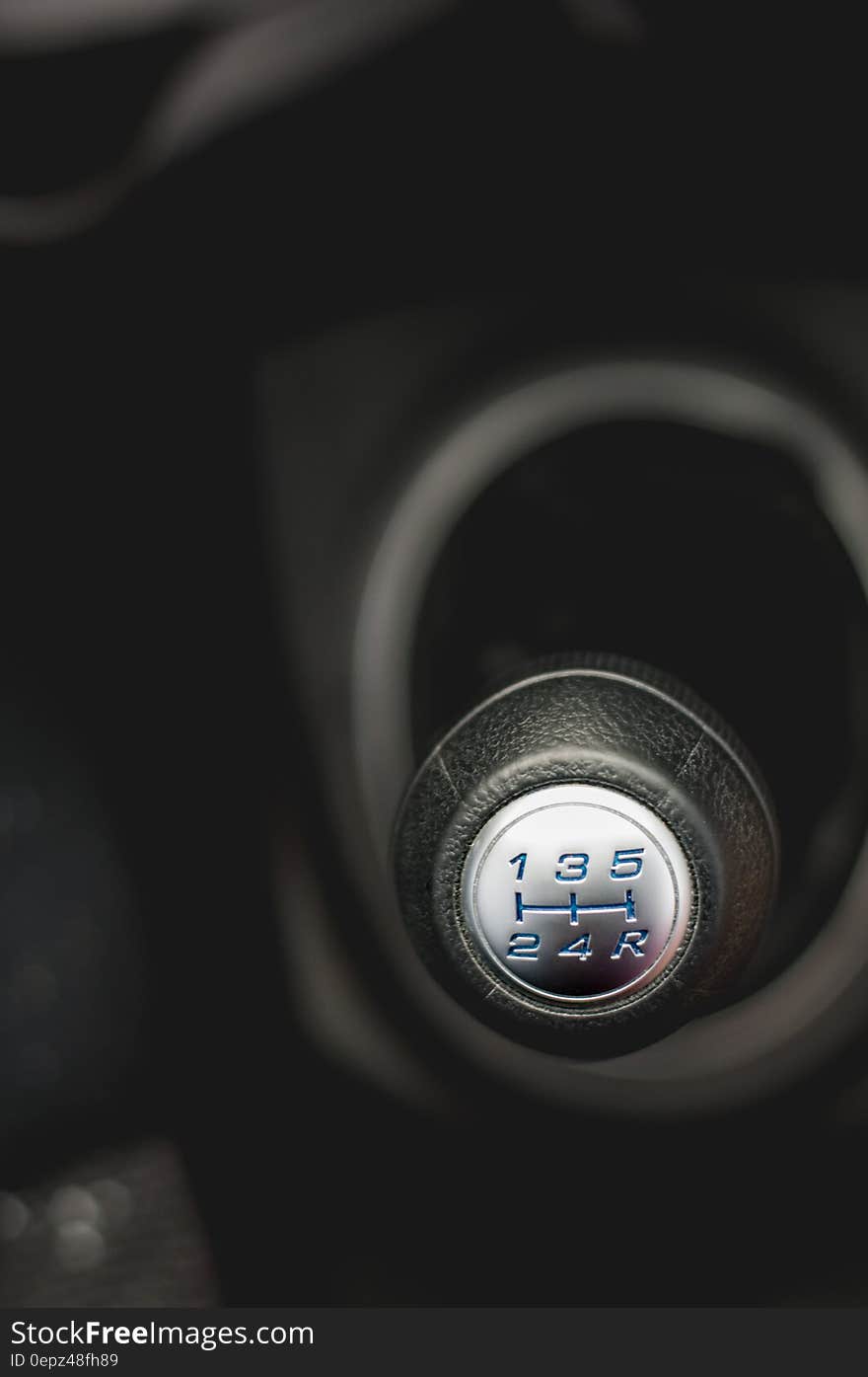 Close up of automotive manual gear shift in black and white. Close up of automotive manual gear shift in black and white.