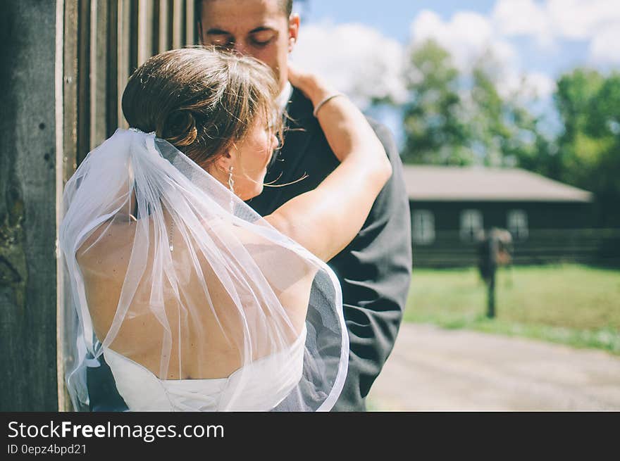 Bride and groom dancing outdoors on sunny day. Bride and groom dancing outdoors on sunny day.