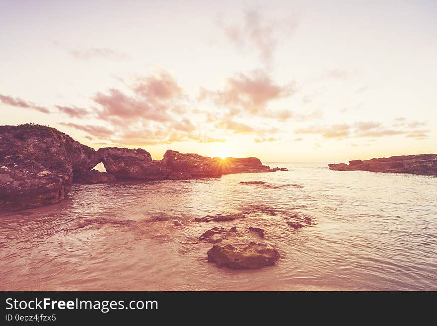 Rocky coastline at daybreak desaturated.