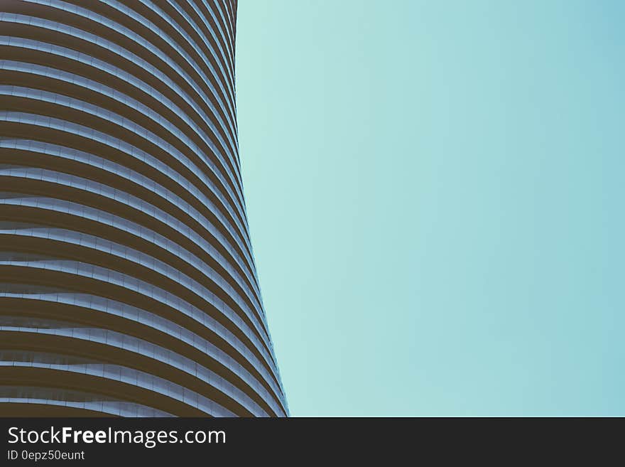 Facade of modern architecture against blue skies on sunny day.