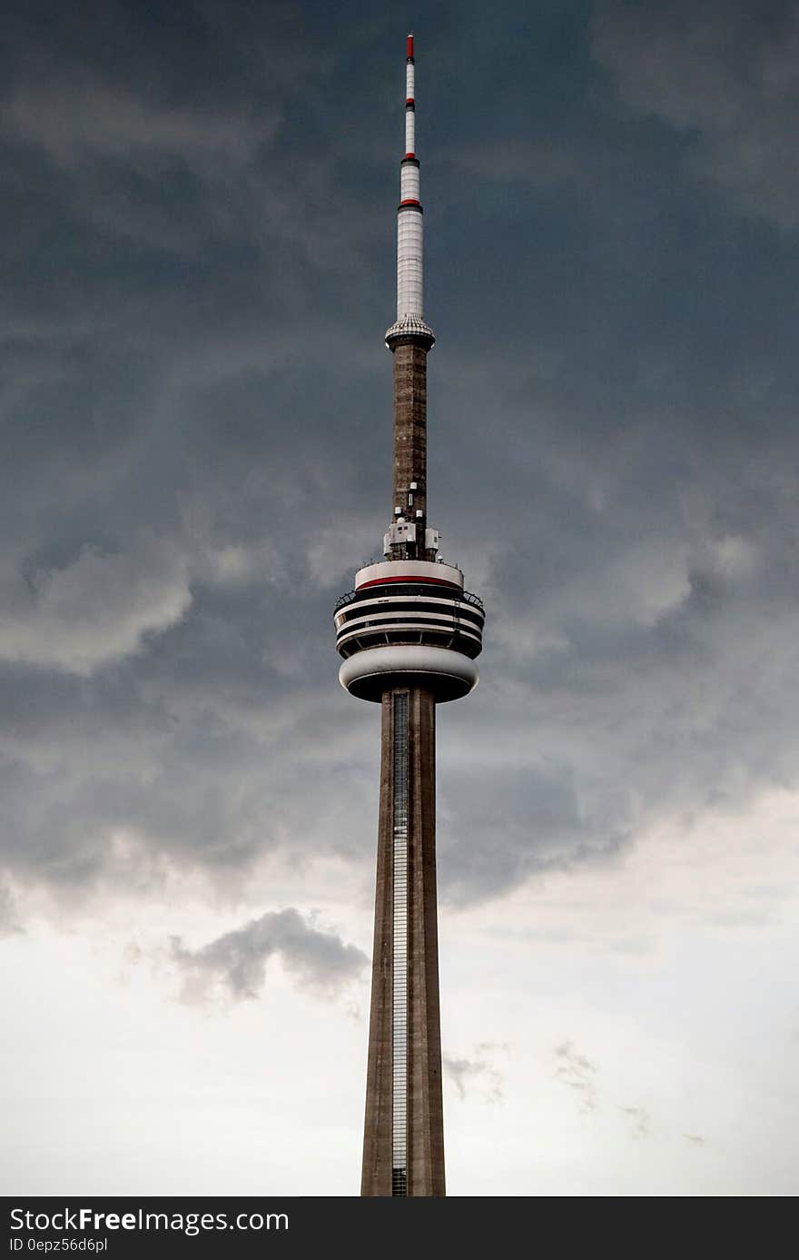 CNN Tower in Toronto, Canada against dark stormy skies. CNN Tower in Toronto, Canada against dark stormy skies.