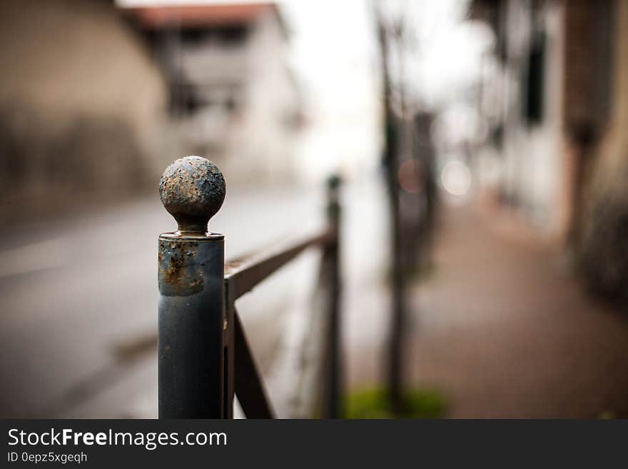 A close up of a metallic railing. A close up of a metallic railing.