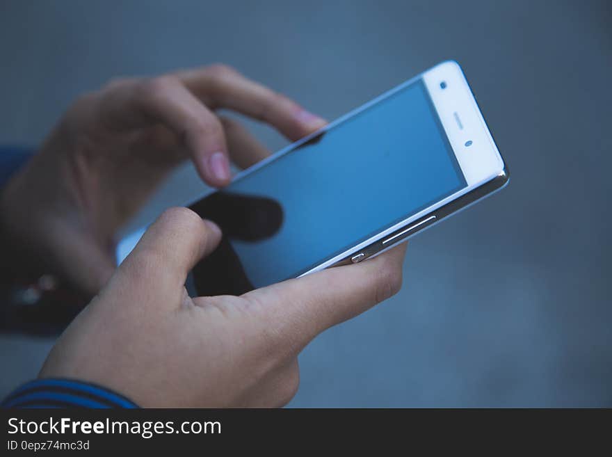 Person Holding White Smartphone