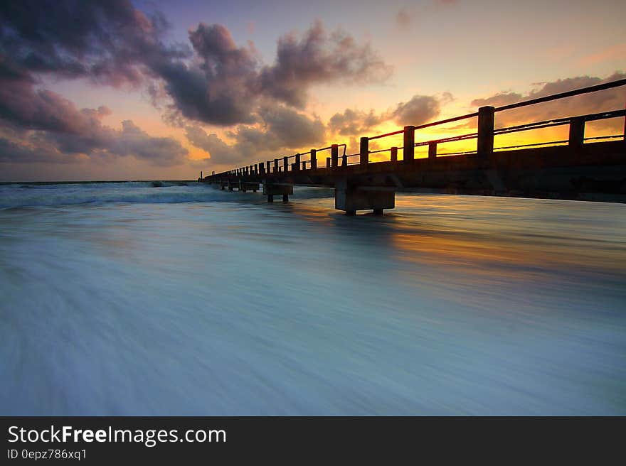 Wooden Pier on Ocean Waves