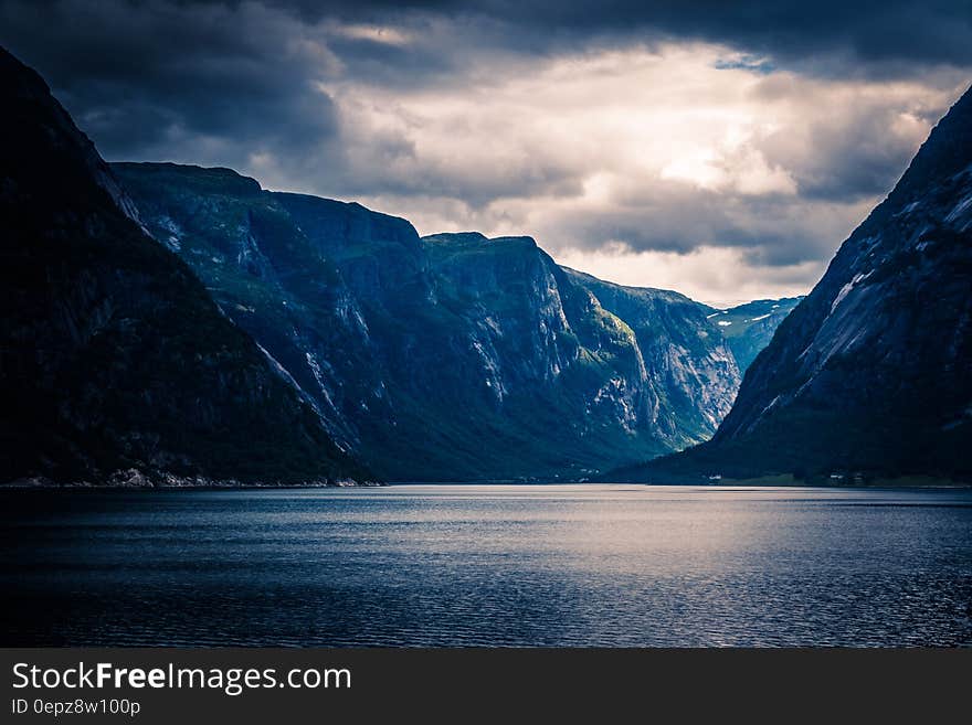 Ocean Near Mountain Ranges during Sunset