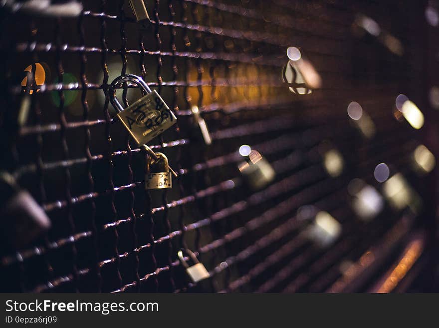 Padlocks on metal grating known as locks of love.