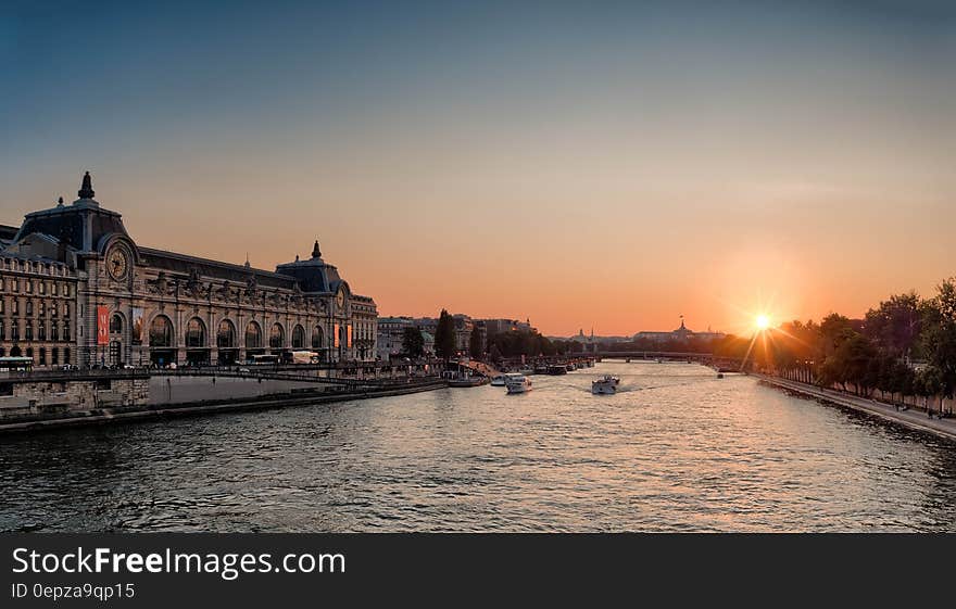 White Speed Boat on River during Sunset