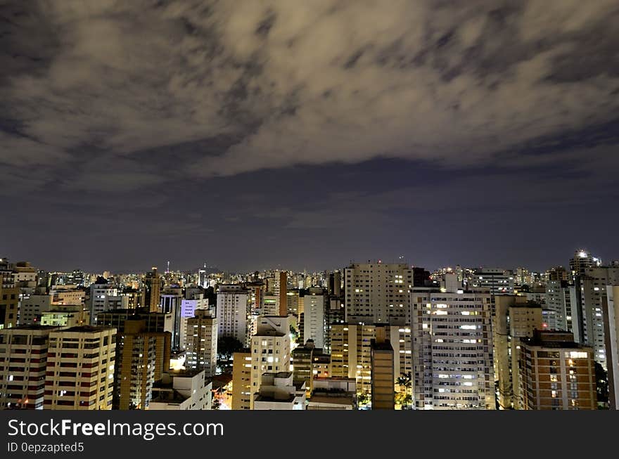 Aerial View of City With High Rise Building at Night Time