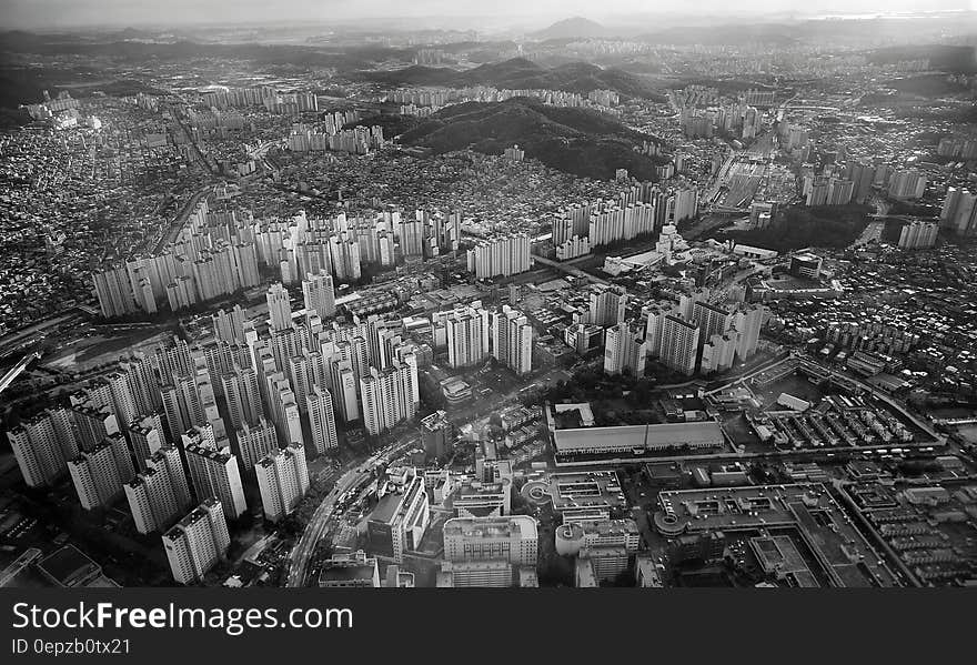 Grey High Rise Buildings Capture from High Angle in Greyscale Photo