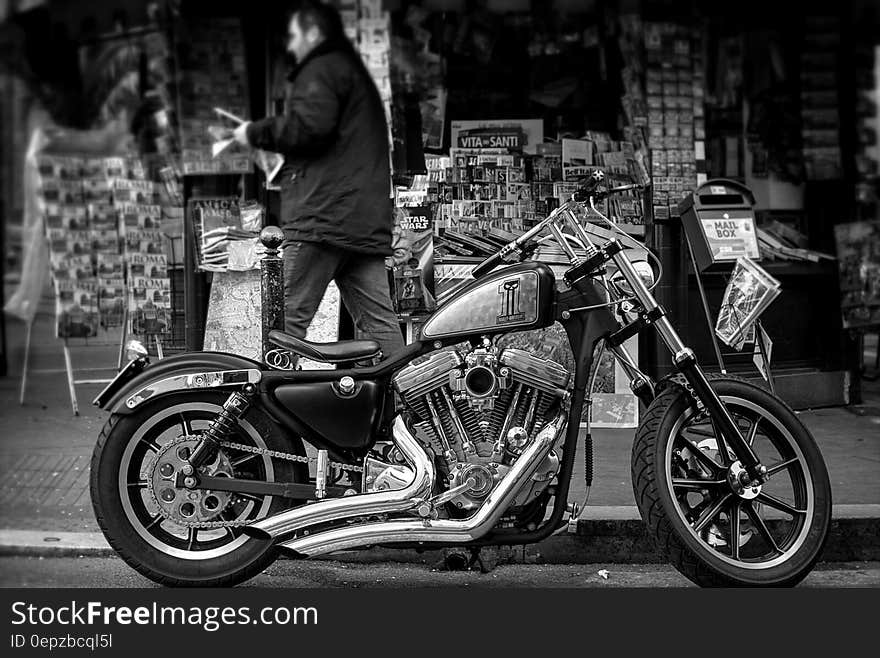 Grayscale Photo of a Cruiser Motorcycle