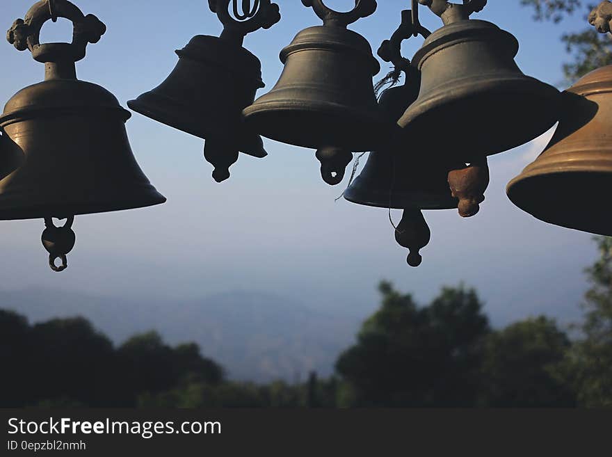 Photography of Black Hanging Bells during Daytime