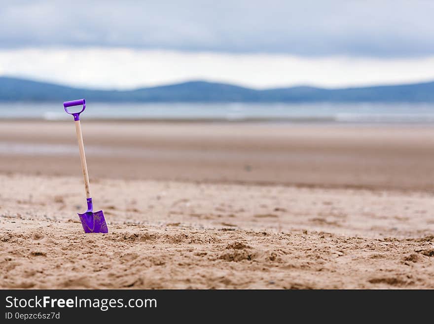 Purple Shovel on Sand Bottom Focus Camera