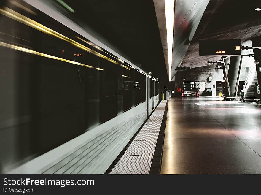 White and Black Subway Train Inside Station