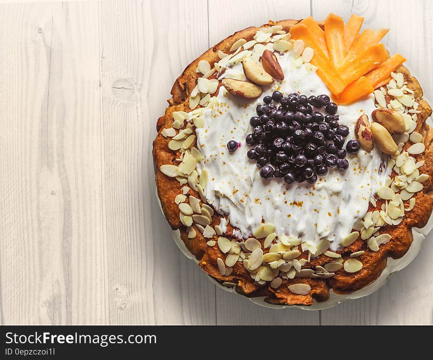 Pastry With Nuts Sliced Mangoes and Blackberries on Top