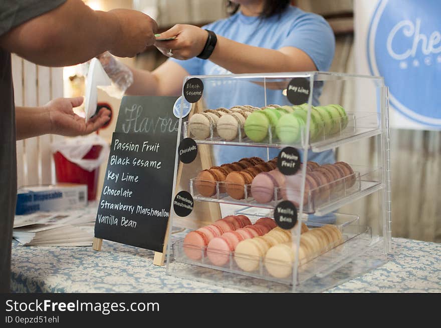 Black Sesame Key Lime Chocolate and Strawberry Macarons in a Glass Display