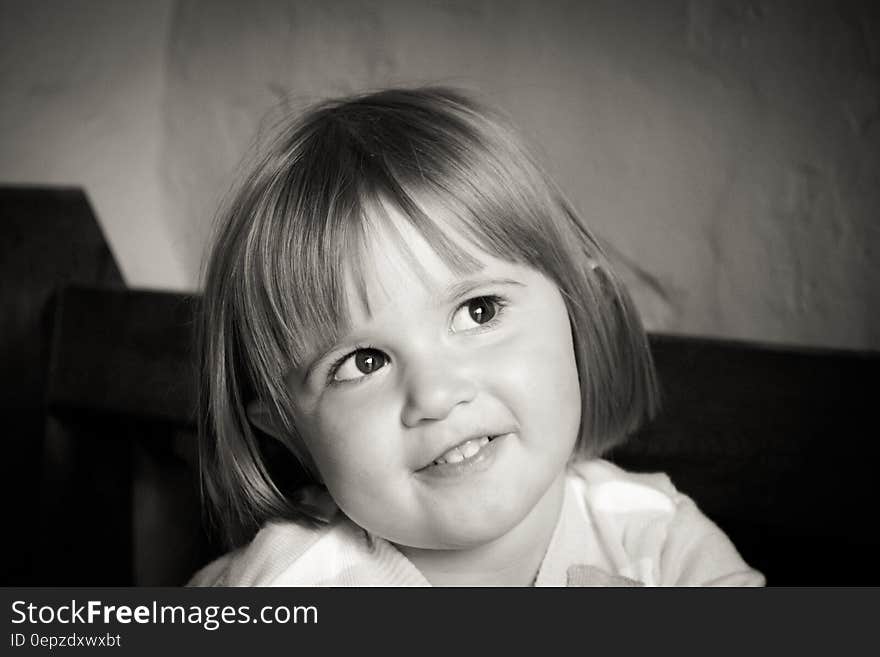 Portrait of Smiling Girl With Short Hair in Grayscale Photography