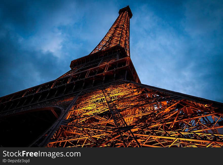 Eiffel Tower Under Cloudy Sky during Nighttime