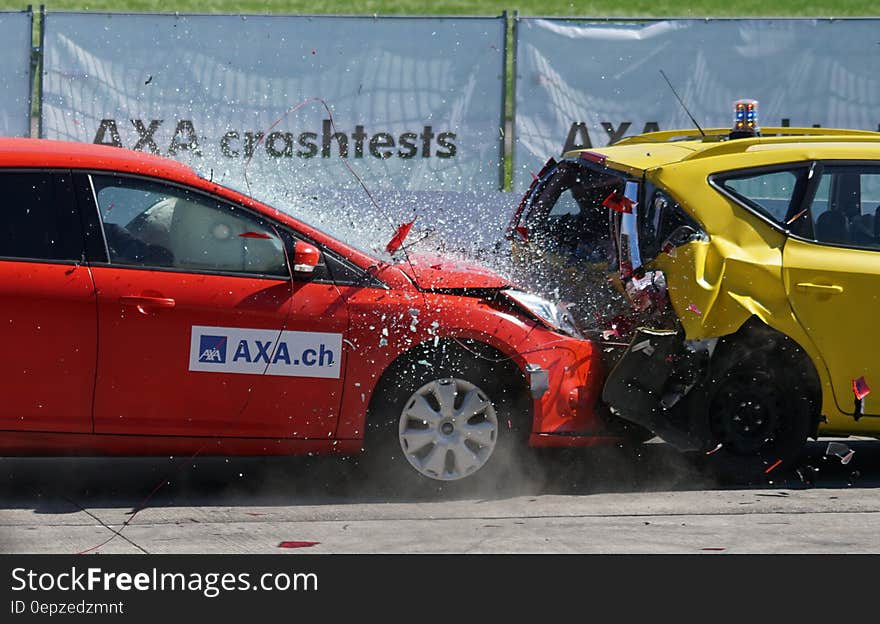 Red and Yellow Hatchback Axa Crash Tests