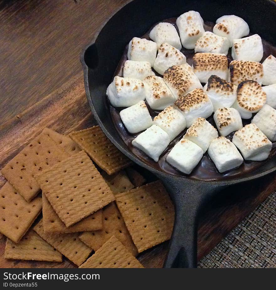 Fried Marshmallows on Top of Black Steel Nonstick Frying Pan