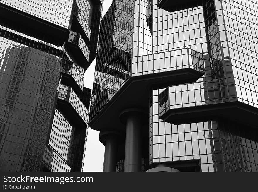 Grayscale Photo of Glass Building