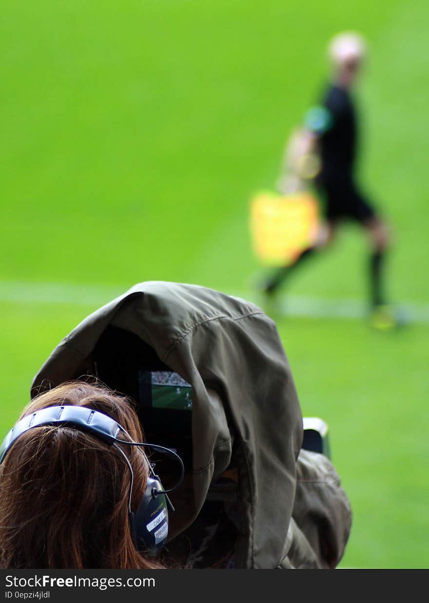 Woman Taking Picture on Man