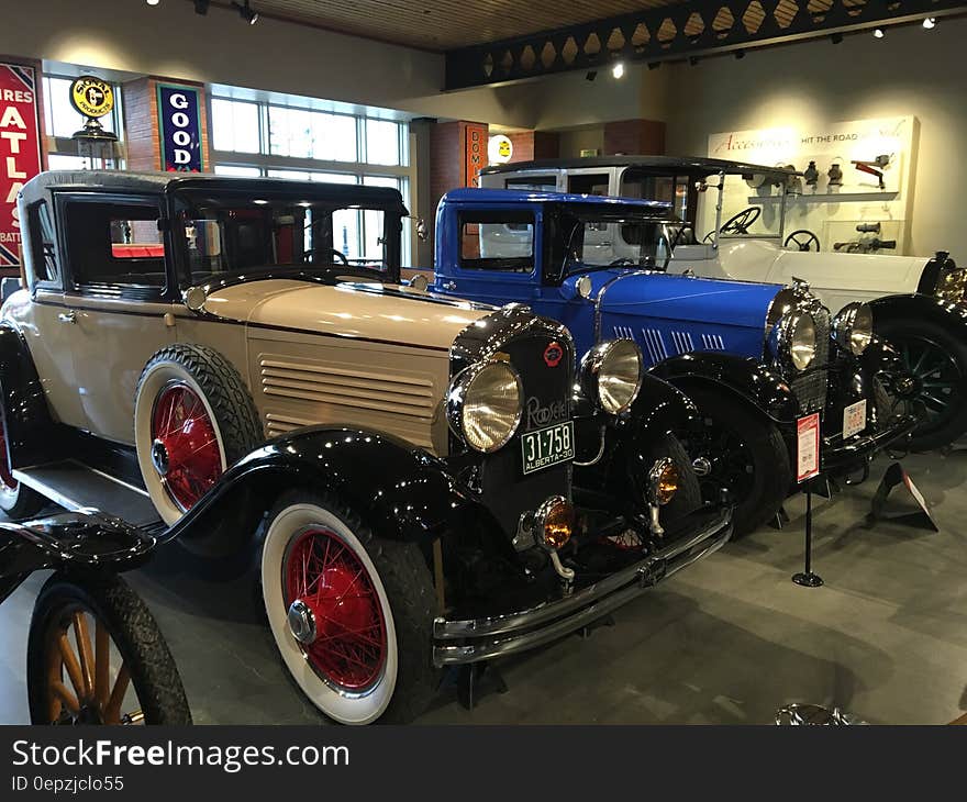 Assorted Vintage Cars in a Well Lighted Room