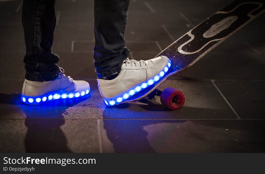 White Sneaker With Led Light on Black and White Long Board