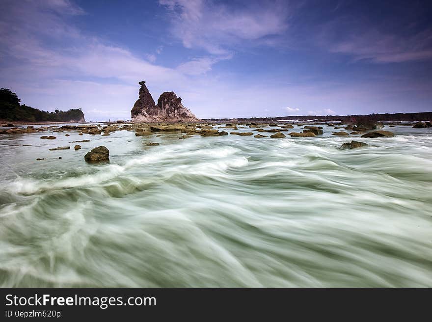 White Clouds over Rocky Isle Time Lapse Photography