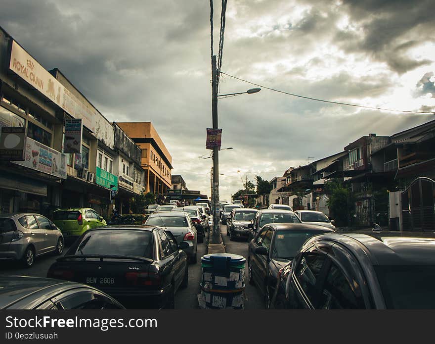 Black and Gray Car Under Cloudy Sky