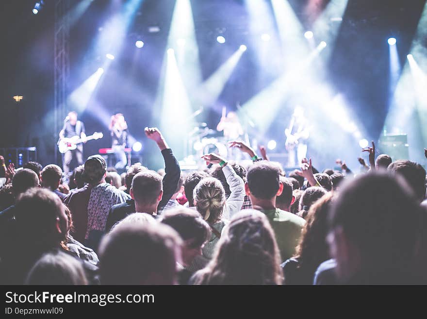 Crowd in Front of People Playing Musical Instrument during Nighttime