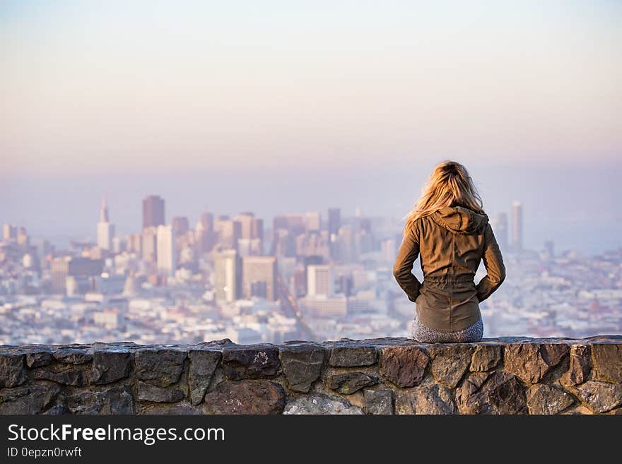 Woman on Rock Platform Viewing City