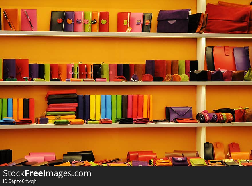 Shelves with colorful book, journals, calendars and other stationery items. Shelves with colorful book, journals, calendars and other stationery items.