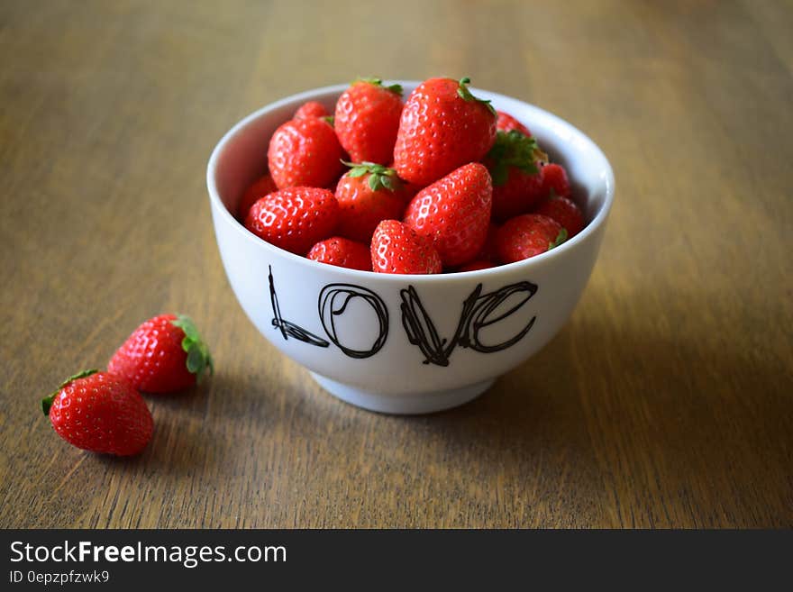 Strawberry on White Ceramic Bowl