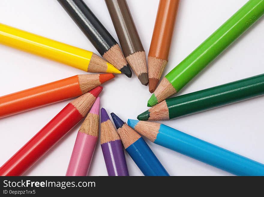 Colored pencils formed into circle on white. Colored pencils formed into circle on white.