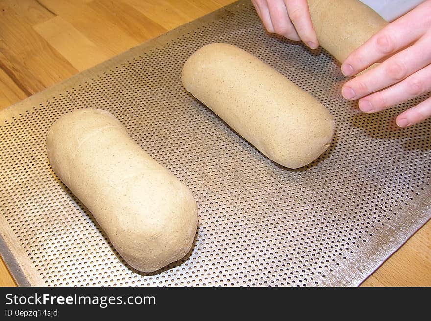 Person Making Brown Bread