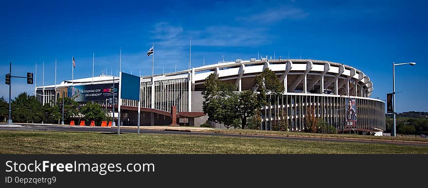 White Concrete Building on Green Grass Field during Daytime