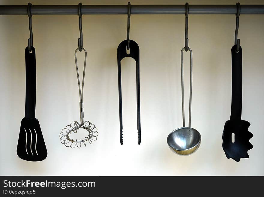 Black Plastic Spatula Hanged on Black Hook