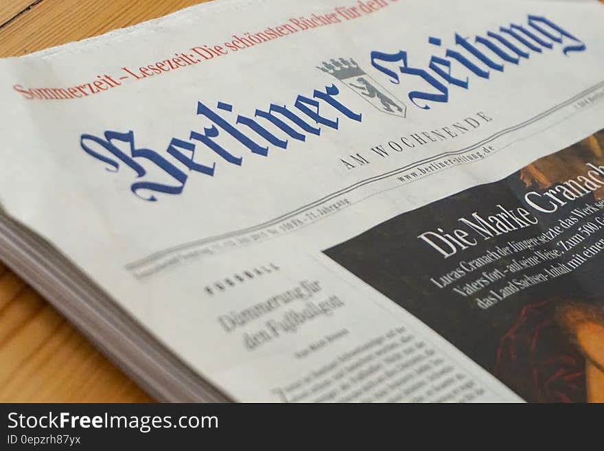 Berliner Zeitung German newspaper front page on wooden table. Berliner Zeitung German newspaper front page on wooden table.