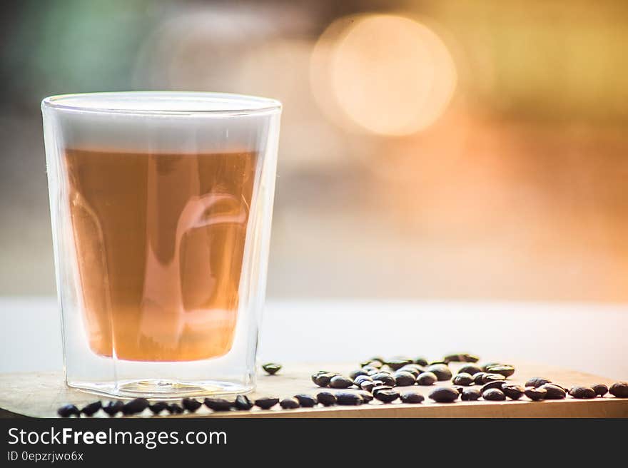 Coffee in Drinking Glass With Black Beans