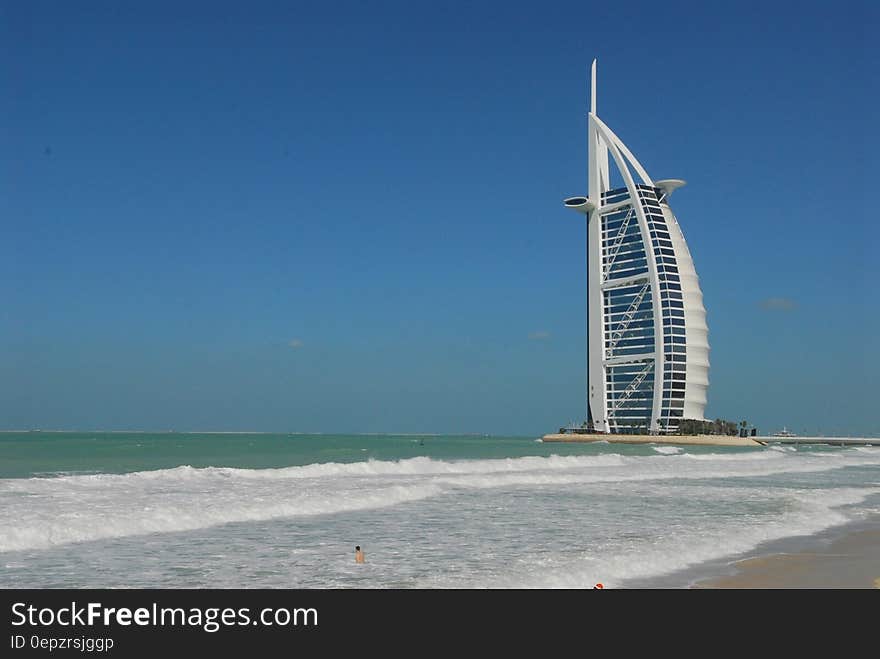 Modern hotel on shape of sailboat along coastline of Dubai, UAE. Modern hotel on shape of sailboat along coastline of Dubai, UAE.