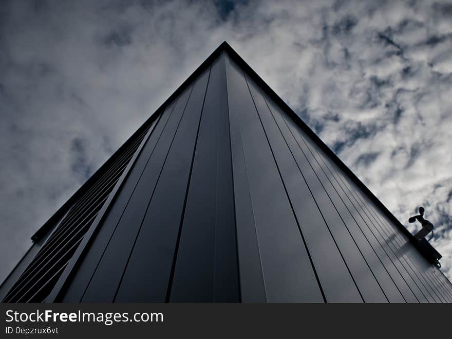 Worm&#x27;s Eye View of Building Under White Cloudy Sky