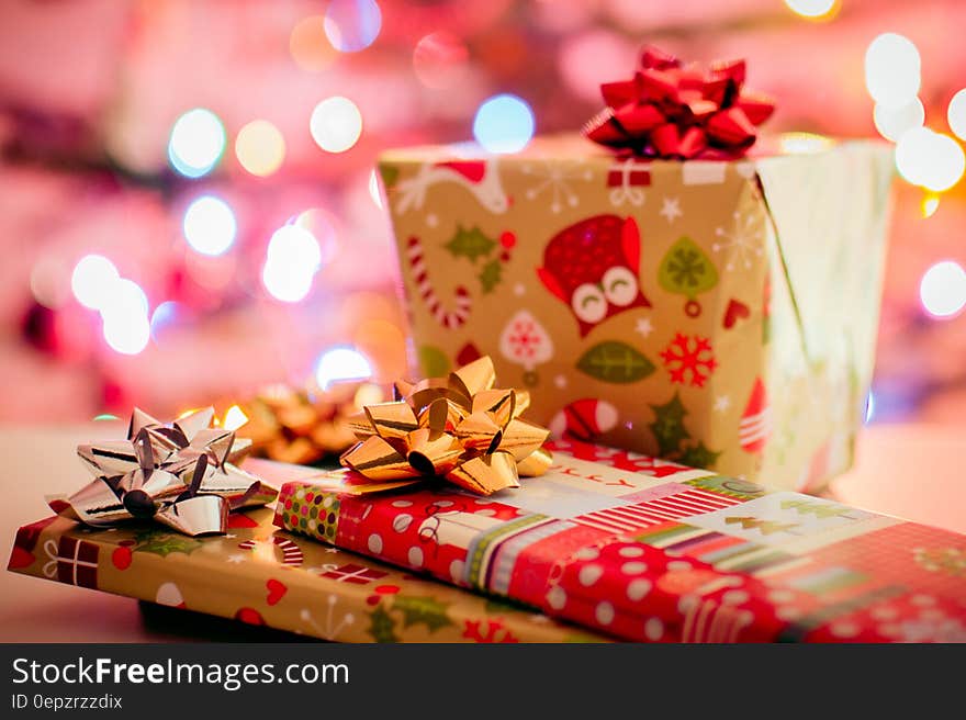 Wrapped Christmas gifts with bokeh light background.