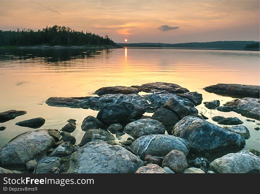 Rocky Lake Shore during Sunset