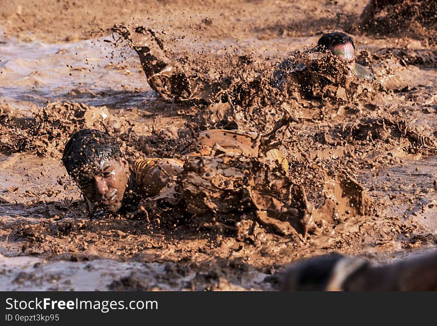 Soldiers in infantry training through mud on sunny day. Soldiers in infantry training through mud on sunny day.