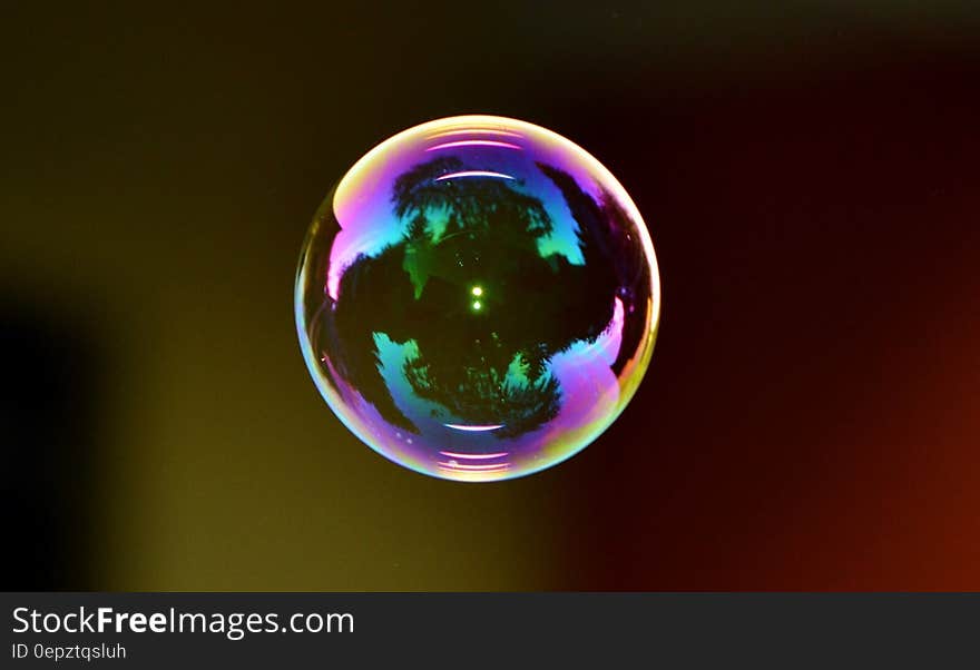 Colorful soap bubble on black.