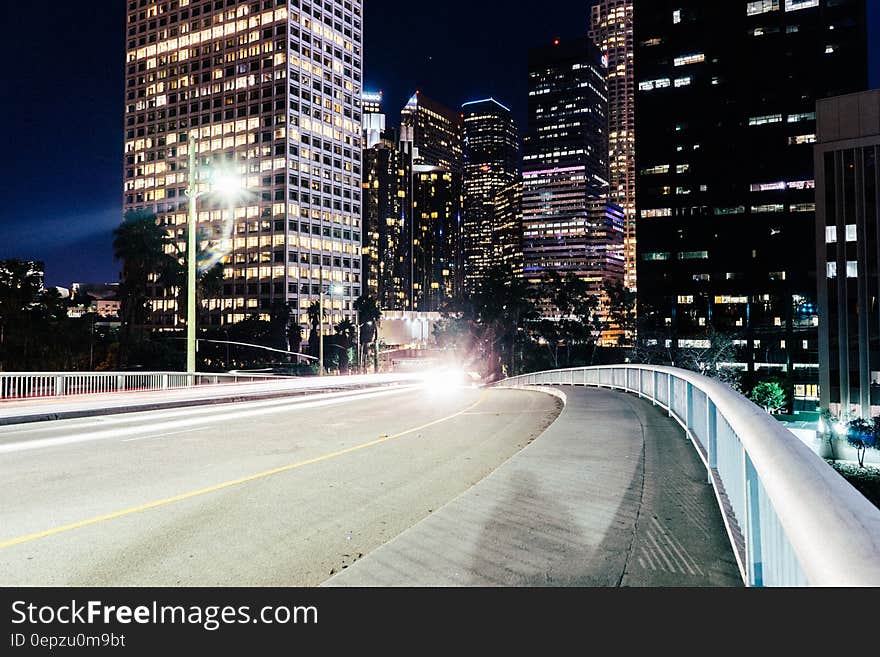 Streetlights illuminated on city streets at night. Streetlights illuminated on city streets at night.