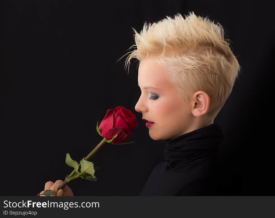 Woman Holding Red Rose