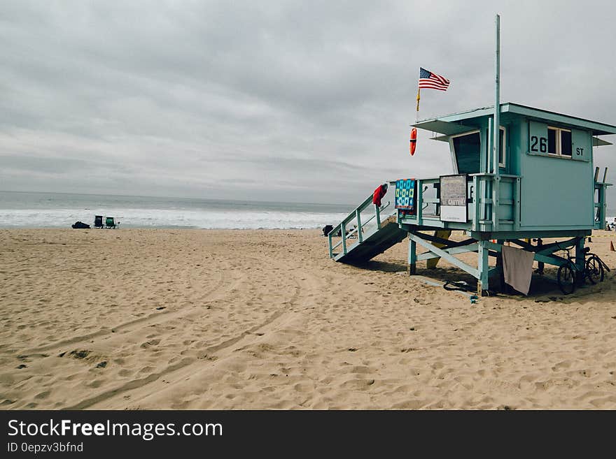 Wooden lifeguard shack on sandy beach. Wooden lifeguard shack on sandy beach.